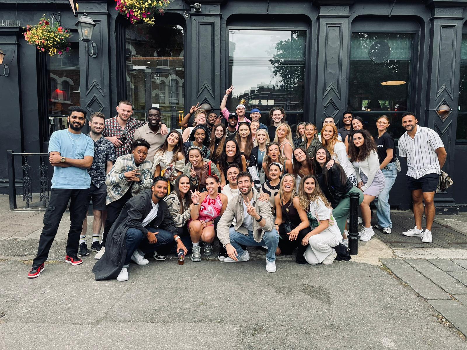 The Socially Powerful team together outside a London pub