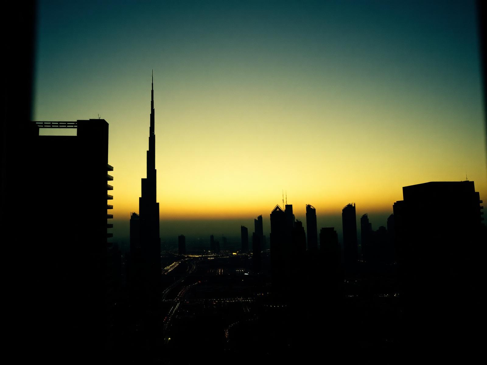 Dubai skyline at dusk seen from a high-rise window